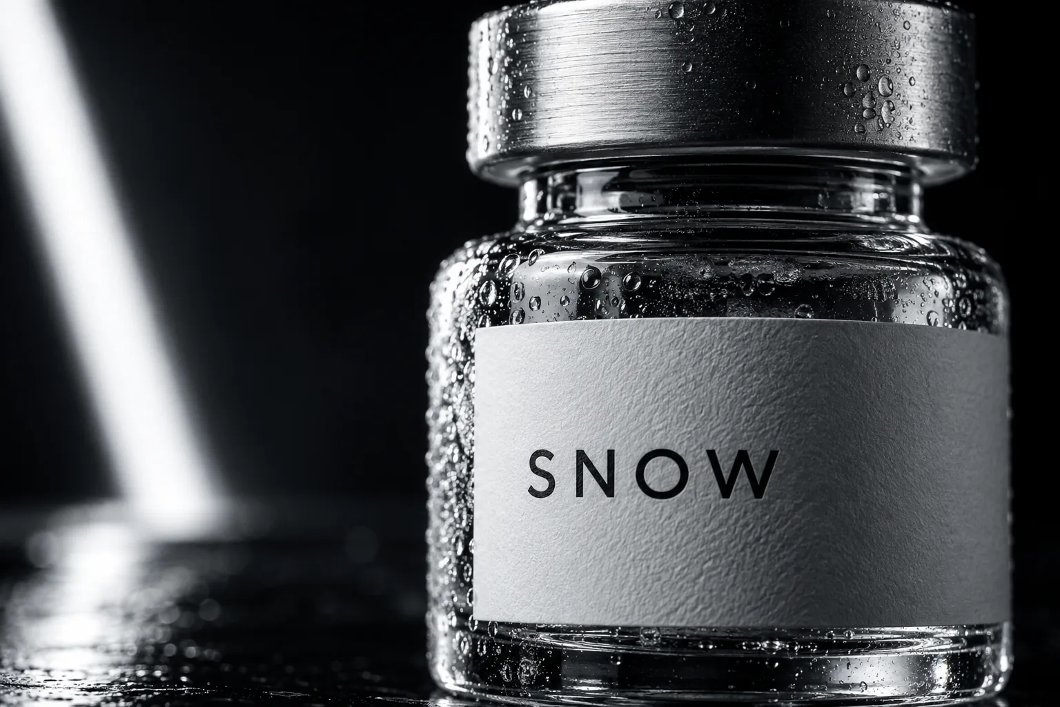 Detailed concept photograph showing the SNOW vial and brushed silver cap